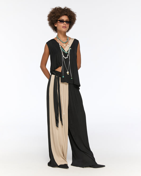 Asymmetrical draped black and beige pleated set