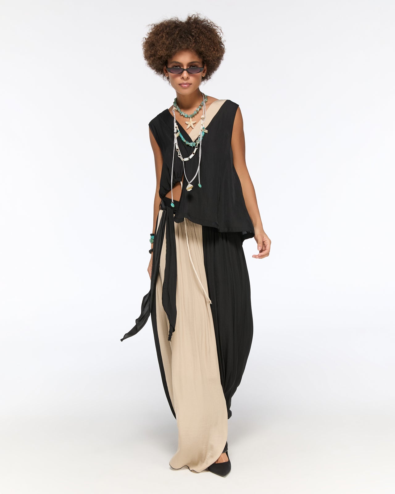 Asymmetrical draped black and beige pleated set