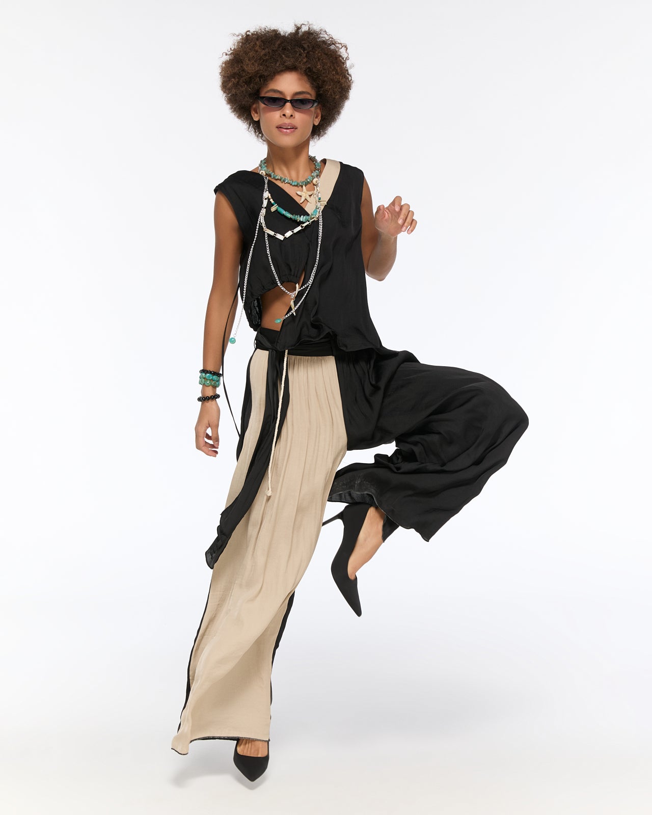 Asymmetrical draped black and beige pleated set