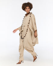 Load image into Gallery viewer, Draped beige oversized shirt and harem-style trousers
