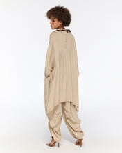 Load image into Gallery viewer, Draped beige oversized shirt and harem-style trousers
