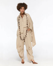 Load image into Gallery viewer, Draped beige oversized shirt and harem-style trousers
